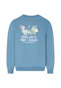 Sudadera azul con dibujos animados de dinosaurios, plantas, tijeras y texto "Ruge como un Dino - Silbon, ¡Demasiado Guay para Extinguirse!" en la espalda.