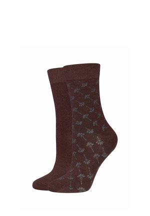 Deux chaussettes marron mi-mollet, une unie et une avec un motif floral bleu clair, présentées côte à côte sur un fond blanc.