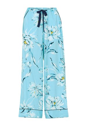 Pantalones florales azul claro con cintura ajustable, con grandes flores blancas y amarillas, diseño fluido y perneras anchas.