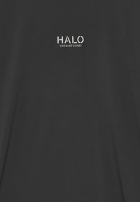 Black t-shirt with short sleeves featuring white "HALO" text and numbers, made of smooth, lightweight fabric, with a crew neckline.