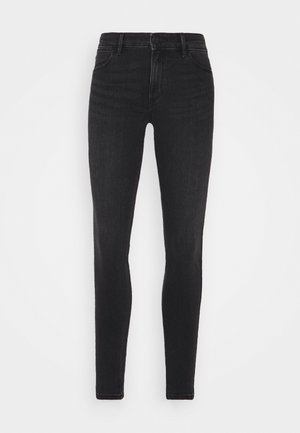 Black skinny jeans made of denim, featuring a high waist, five-pocket design, and subtle fading details, with a smooth texture.
