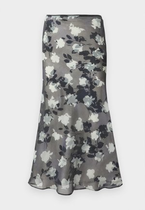 Jupe midi grise avec imprimé floral en noir, blanc et gris et légère évasement à l'ourlet.