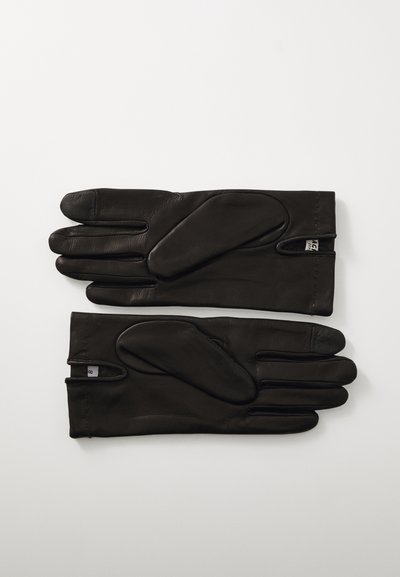 Gants en cuir noir avec une texture lisse, présentant un design divisé pour le pouce et des poignets allongés. Comprend de petites étiquettes près du poignet.