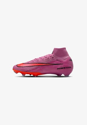 Pink high-top soccer cleat with red sole, black Nike swoosh, and "AIR ZOOM" text on the heel, designed for firm ground play.