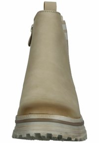 Beige ankle boot with smooth leather upper, elastic side panel, and pull tab. Features a textured rubber sole with traction grooves.