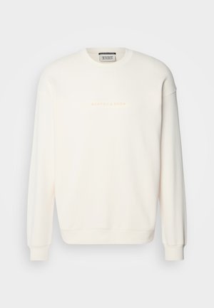 Sweatshirt crème clair avec un col rond classique, des poignets et un ourlet côtelés. Présente un subtil logo "SCOTCH & SODA" en beige clair sur la poitrine.