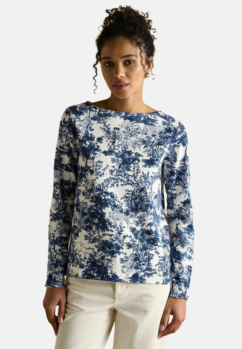 Pikem varrukatega topp, millel on sinine ja valge lillemuster, pehmest kangast, laia kaelusega ja mugavalt istuv.