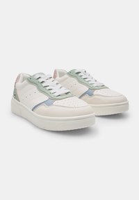 White leather sneakers with green and blue accents, featuring a textured toe cap, perforations, and white laces. Smooth sole with a slight platform.