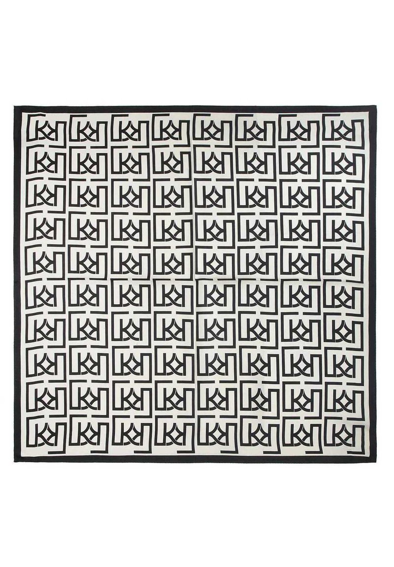 Czarny i biały prostokątny dywan z powtarzającym się geometrycznym wzorem stylizowanych liter, oprawionych w kwadraty, z solidną czarną krawędzią.
