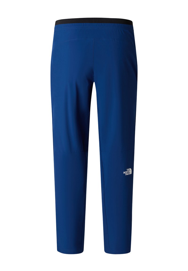Pantalones outdoor elásticos y azules con cintura elástica y el logo de The North Face en el muslo derecho, vistos desde la parte posterior.