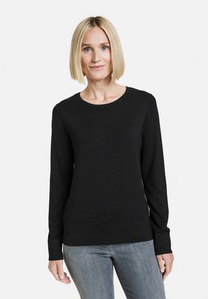 Schwarzer Pullover mit langen Ärmeln und rundem Halsausschnitt, aus einem glatten Stoff gefertigt. Die Bündchen und der Saum sind leicht tailliert und sorgen für eine schlanke Optik.