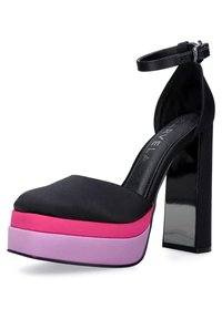 Black platform sandal with a rounded toe, featuring a thick pink and purple layered sole, ankle strap, and a glossy black high heel.