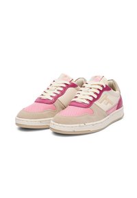 Sneakers featuring a mix of beige, pink, and fuchsia materials, with a textured finish, perforated panels, and a white rubber sole.
