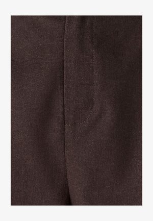 Dark brown fabric detail of a textile with a textured surface, featuring a visible seam and a side pocket design.