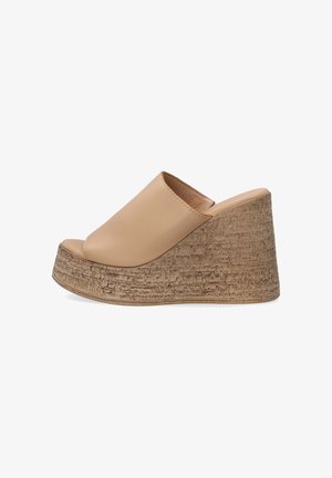 Beige leather wedge mules with a rounded open toe, textured cork-like platform, and smooth upper.