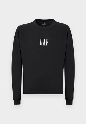 Svart sweatshirt i mjukt tyg med rund halsringning och långa ärmar. "GAP"-logotyp tryckt i vitt på framsidan.