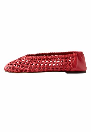 Red flat shoe with woven leather upper and solid leather heel, featuring a closed toe and slip-on style.