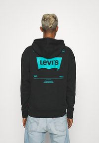 Levi's® RELAXED GRAPHIC - Sweatshirt com capuz - black