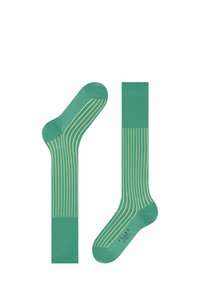 Calze verdi con strisce verticali gialle, tessuto in misto cotone, texture a coste e design con punta e tallone rinforzati.