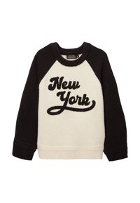Sweatshirt noir et crème avec des manches raglan, présentant une texture douce et "New York" brodé en cursive sur le devant.