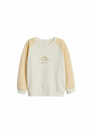 Sweatshirt crème avec des manches raglan jaune pâle. Présente un design de stégosaure brodé et des poignets côtelés. Matière douce en mélange de coton.