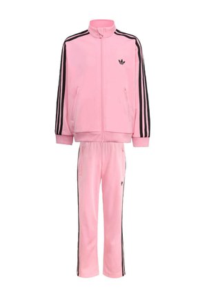 Pink Adidas tracksuit with black side stripes, zip-up jacket with high collar, and matching pants with elastic waistband and pockets.