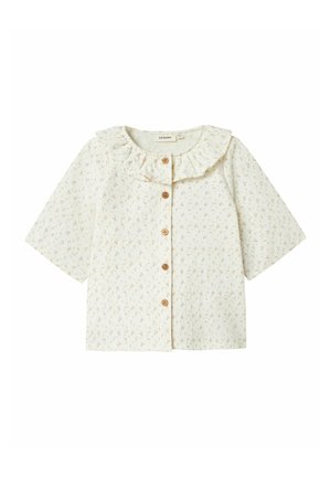 Korte mouwen crèmekleurige blouse met een ruche kraag, bloemmotief en houten knopen aan de voorkant. Gemaakt van zachte, lichte stof.