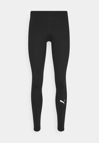 Czarne legginsy wykonane z elastycznego materiału o dopasowanym kroju. Posiadają biały logo Puma na dolnej części nogawki. Gładka struktura i brak wzorów.