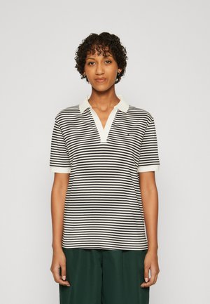 Gestreepte polo in navy en crème met een kraag, korte mouwen en een klein logo detail op de linkerborst.