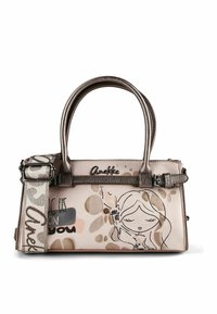 Kleine Handtasche mit metallischen Griffen, dekorativem Cartoon-Mädchen, beigen und braunen abstrakten Flecken sowie verstellbarem, gemustertem Schultergurt.