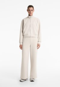 OYSHO SOFT TOUCH HIGH COLLAR STRIPED - Zip-up sweatshirt - sand