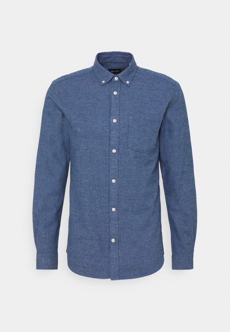 Blauwe button-up shirt in gestructureerde stof, met een kraag, een borstzak en witte knopen. Lange mouwen met een ronde zoom.