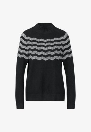 Musta neule, jossa on ribbimekko ja aaltoileva valkoinen raidoitus ylärinnassa. Pehmeä materiaali rentoa istuvuutta varten.