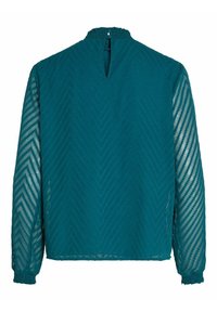 Blusa teal con maniche lunghe trasparenti, caratterizzata da un motivo a spina di pesce. Collo arricciato e dettaglio a occhietto sul retro con polsini elasticizzati.