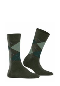 Chaussettes vert foncé avec un motif argyle en verts plus clairs et une finition texturée, dotées d'une bordure côtelée et d'une zone de orteil renforcée.