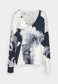 Pull à manches longues en V, mélange de bleu marine et blanc, orné d'un imprimé floral et de formes abstraites. Texture douce avec des poignets côtelés.