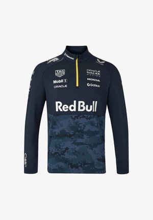 Granatowy długi rękaw sweter z półzamkiem i wzorem w kamuflaż cyfrowy, z logo w białych i żółtych akcentach. Miękki, elastyczny materiał.