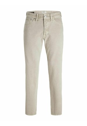 Light beige denim jeans with a slim fit, featuring a button fly, five pockets, and subtle texture throughout the fabric.