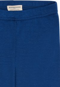 Blauwe katoenen leggings met een gladde textuur en een elastische tailleband. Beschikt over een label met de merknaam aan de binnenkant van de tailleband.