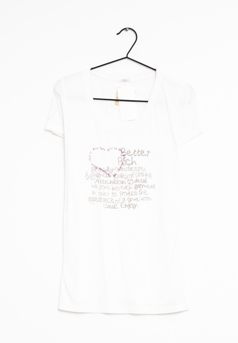 Valkoinen T-paita, jossa on avara kaula-aukko. Sisältää vaaleanruskeita ja vaaleanpunaisia tekstiä graafisia elementtejä sydänkuvion kanssa. Puuvillamateriaalia, lyhyet hihat.