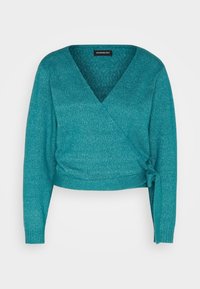 Tealfärgad omslagströja med djup V-hals, långa ärmar och knytdetalj i midjan. Tillverkad av ett mjukt, texturerat tyg med en subtil lyster.