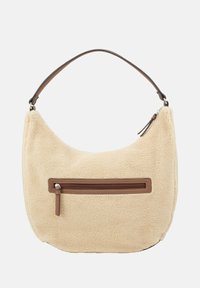 Kremowa torba o miękkiej, teksturowanej powierzchni, z brązową zamykaną na zamek kieszenią z przodu oraz brązowym paskiem na ramię.