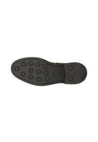 Zool van een bruine leren schoen met een zwarte rubberen buitenzool, voorzien van ronde profielpatronen en gestikte randen.