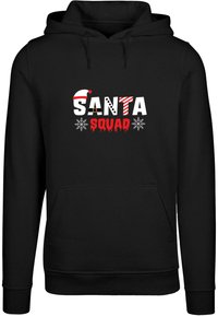 Černá mikina s kapucí s potiskem, na kterém je nápis "SANTA" v mnoha barvách a "SQUAD" v červené, doplněné sněhovými vločkami a santovskou čepicí.
