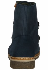 Navy blue suede ankle boots with a round toe, brown rubber sole, stitched design, and decorative side accents. Back view showing zipper.