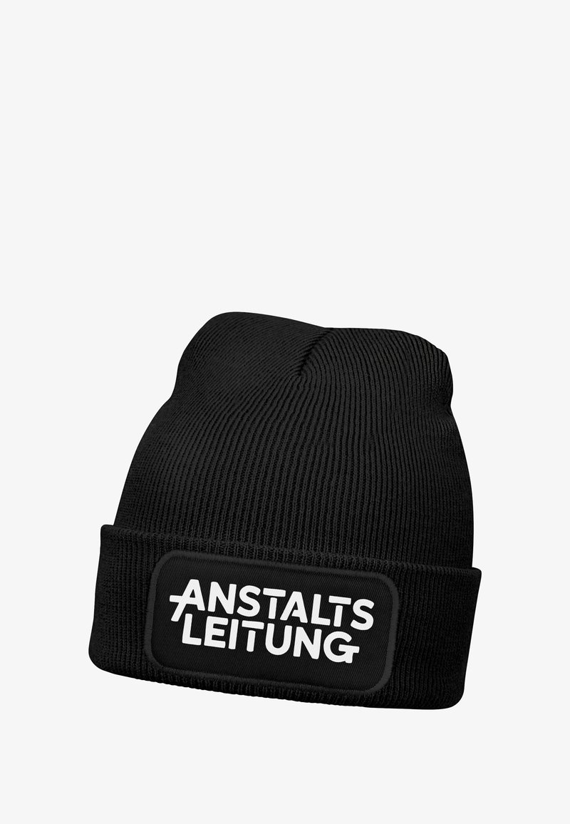 Black knit beanie featuring a turned-up cuff and a rectangular logo patch with the text "ANSTALTSLEITUNG" in bold white letters.