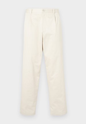 Heledad beežist puuvillast chinos püksid sirge lõikega, millel on nupuga sulgemine ja kaks küljetaskut. Sile tekstuur, ilma nähtavate mustriteta.