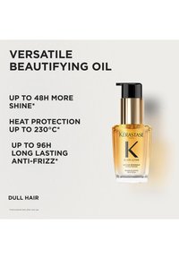 Bouteille en verre transparent avec un bouchon-pompe doré et noir contenant une huile dorée. Le texte met en avant les bénéfices : brillance, protection contre la chaleur, anti-frisottis.