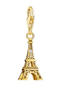 Goldfarbener charm in Form des Eiffelturms mit detaillierter Durchbruchsdesign und einem klaren Kristallakzent. Mit einem Befestigungsverschluss für sicheren Halt.