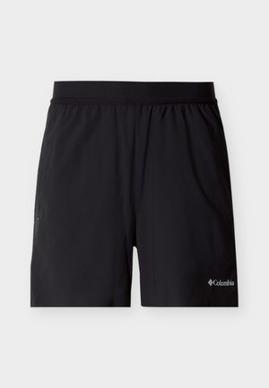 Pantalones deportivos Columbia en color negro con cintura elástica y pequeño logo en la parte inferior derecha, mostrados sobre un fondo blanco liso.